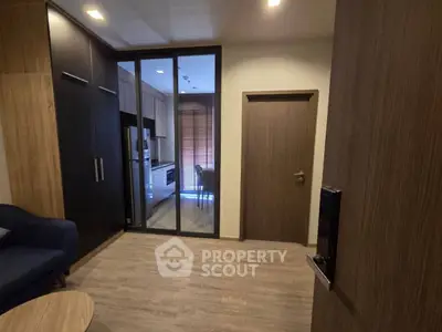 Modern apartment interior with glass partition and wooden flooring