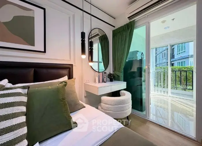 Stylish bedroom with modern decor and balcony access in urban apartment.