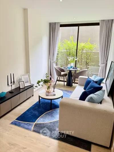 Modern living room with elegant decor, large window, and stylish furniture in a cozy apartment setting.