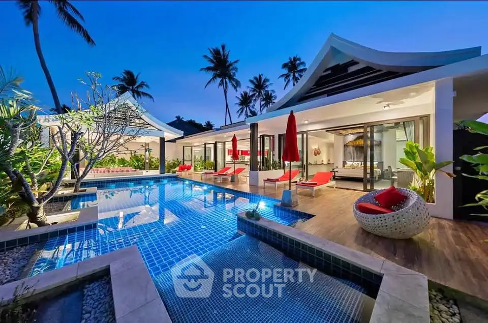 Luxurious tropical villa with stunning pool and modern architecture at dusk.