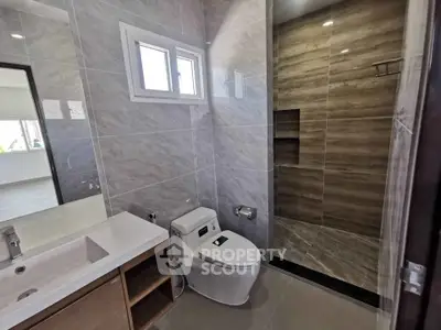 Modern bathroom with sleek design and spacious shower area