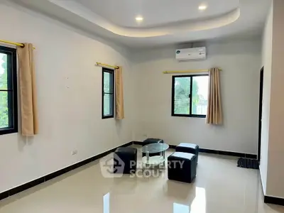 Spacious living room with modern design and natural light