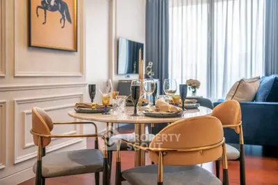 Elegant dining area with stylish table setting in modern living room, featuring chic decor and natural light.