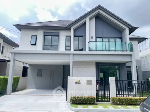 Modern two-story house with sleek design and spacious balcony