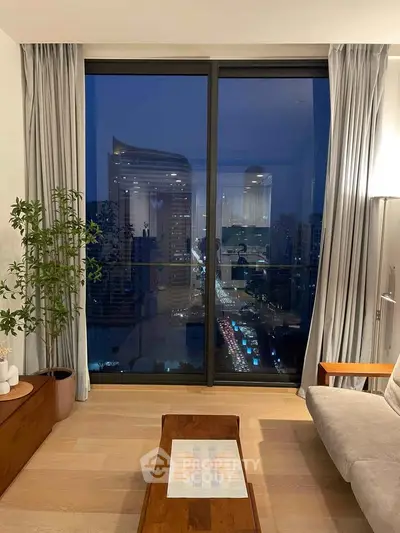 Luxurious living room with stunning city view through large windows, elegant decor, and cozy ambiance.