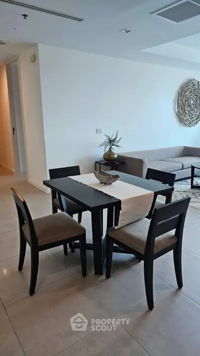 Modern living room with elegant dining set and stylish decor