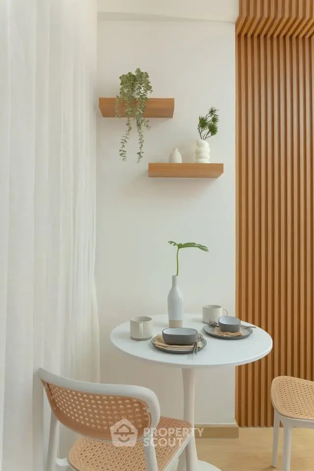 Chic dining nook with modern decor and wooden accents, perfect for cozy meals.