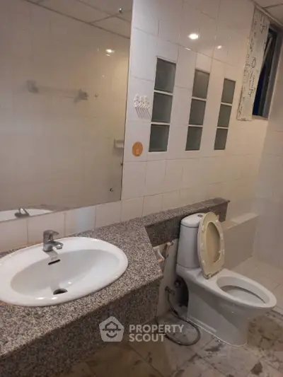 Spacious bathroom with modern fixtures and granite countertop