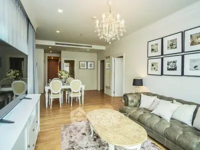 Elegant living room with chandelier and stylish decor in modern apartment