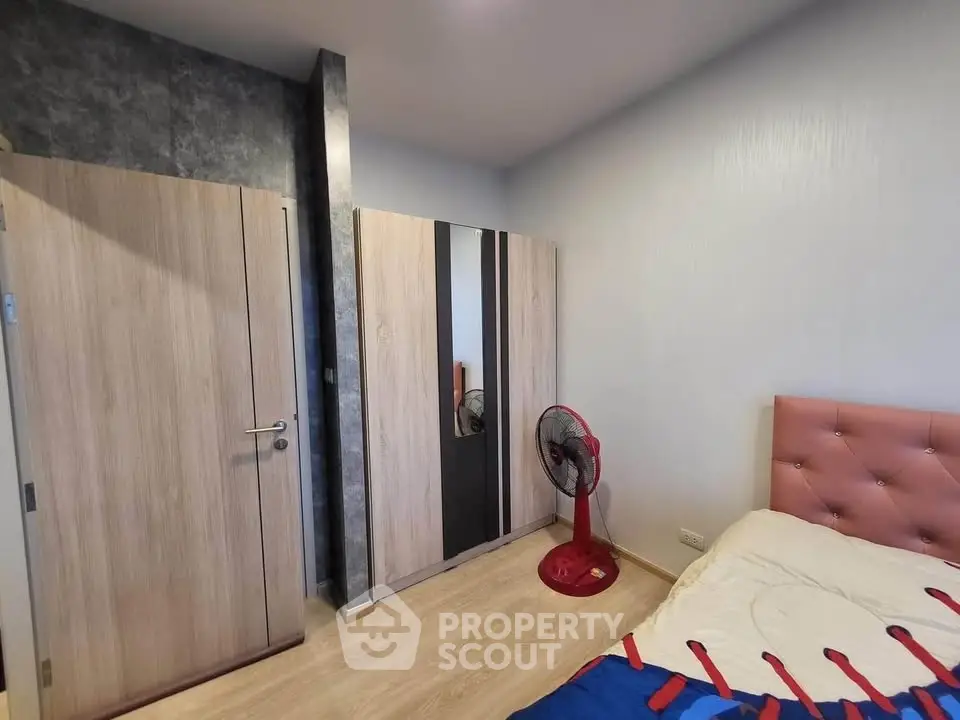 Cozy bedroom with modern wardrobe and stylish decor