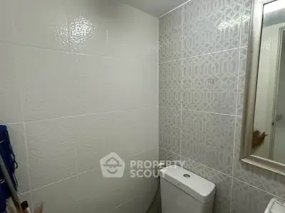 Modern bathroom with stylish tile design and sleek fixtures.
