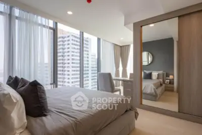 Luxurious bedroom with floor-to-ceiling windows and city view in modern apartment.