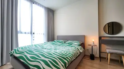 Modern bedroom with stylish decor and natural light