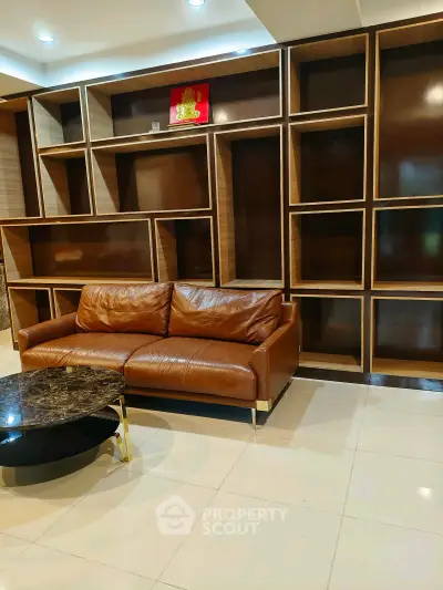 Luxurious living room with elegant leather sofa and modern shelving unit