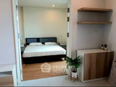 Modern bedroom with minimalist decor and wooden flooring