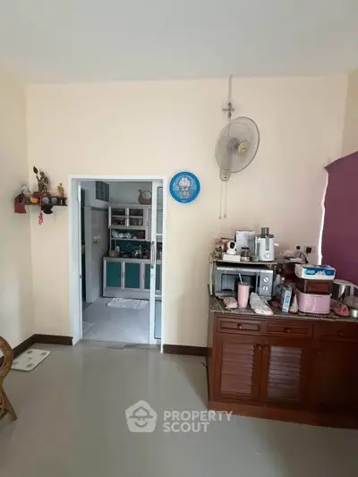 Cozy kitchen with open layout and modern appliances, perfect for culinary enthusiasts.