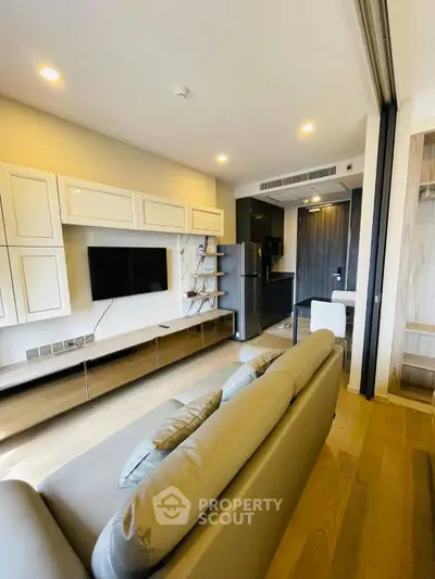 Modern living room with sleek design and open kitchen layout