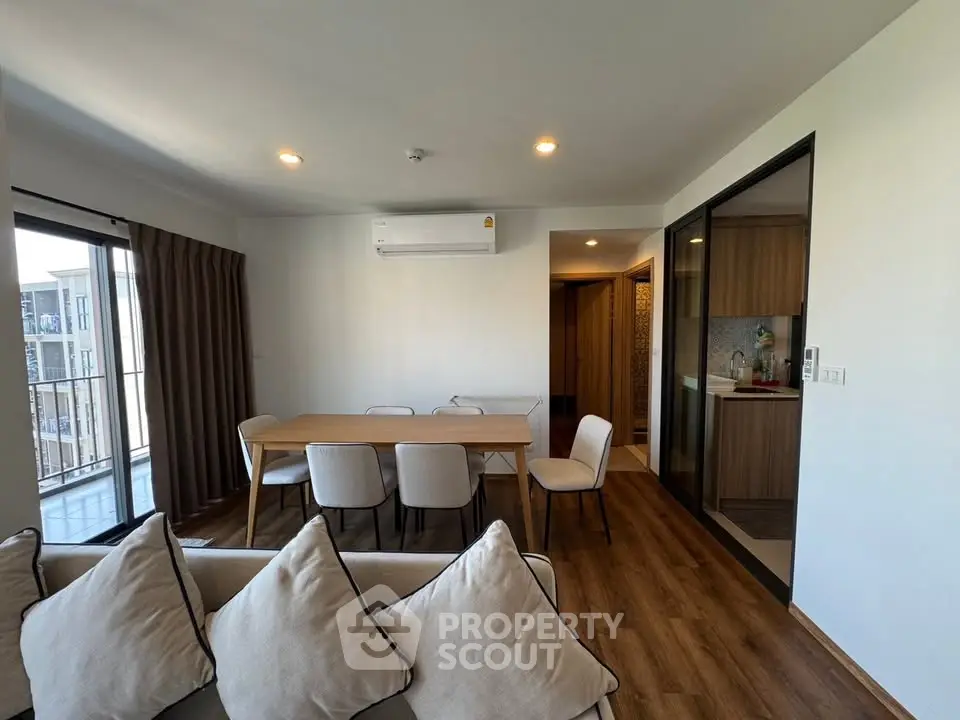 Modern living room with dining area and open kitchen in stylish apartment