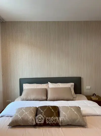 Cozy bedroom with stylish decor and comfortable bedding