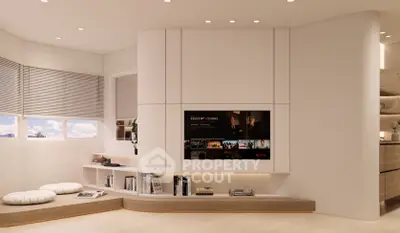 Modern living room with built-in entertainment center and cozy seating area.