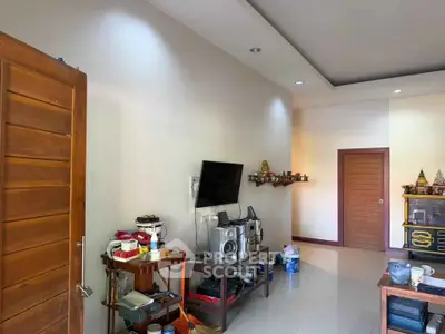Cozy living room with modern decor and entertainment setup, perfect for relaxation and leisure.