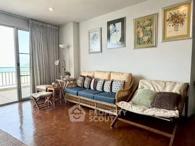 Charming living room with ocean view, cozy seating, and elegant decor, perfect for relaxation and entertaining.