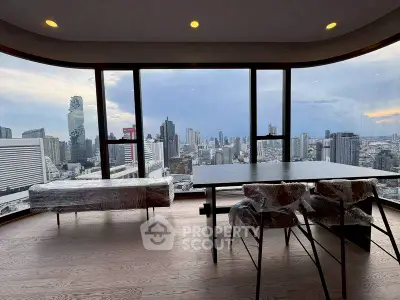 Stunning high-rise apartment with panoramic city views and modern furnishings.