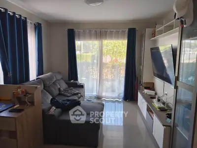 Cozy living room with modern decor and large windows for natural light