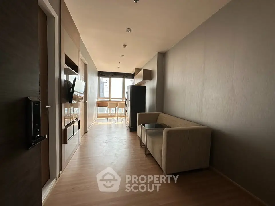Modern apartment interior with sleek design and natural light, featuring a cozy living area and stylish furnishings.