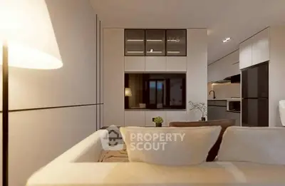 Modern living room with sleek design and integrated kitchen area