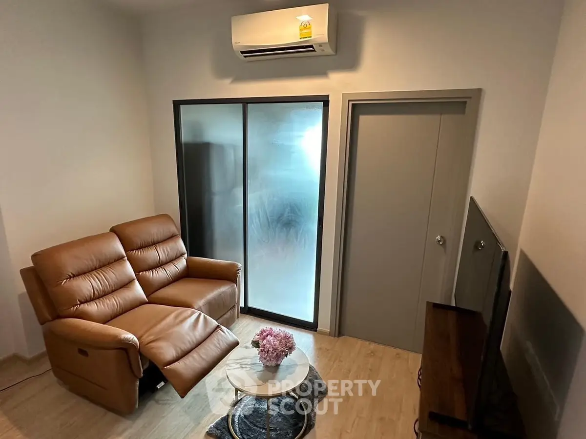 Cozy living room with leather recliner and modern decor, perfect for relaxation.