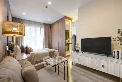 Modern studio apartment with cozy living area and stylish decor