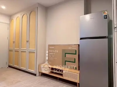 Modern kitchen with sleek fridge and ample storage space