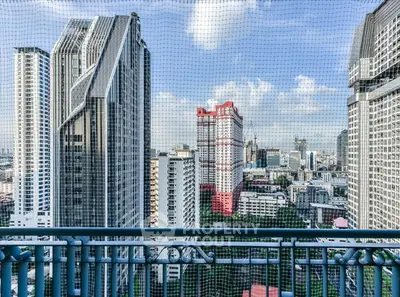 Stunning cityscape view from high-rise balcony with modern architecture