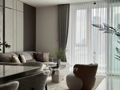 Modern living room with elegant decor and large windows offering city views.