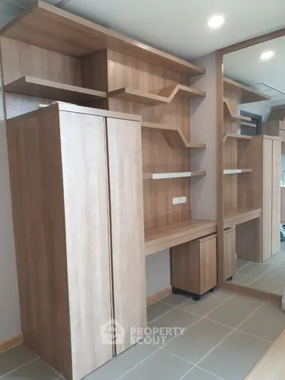 Modern study room with wooden shelves and mirrored wardrobe