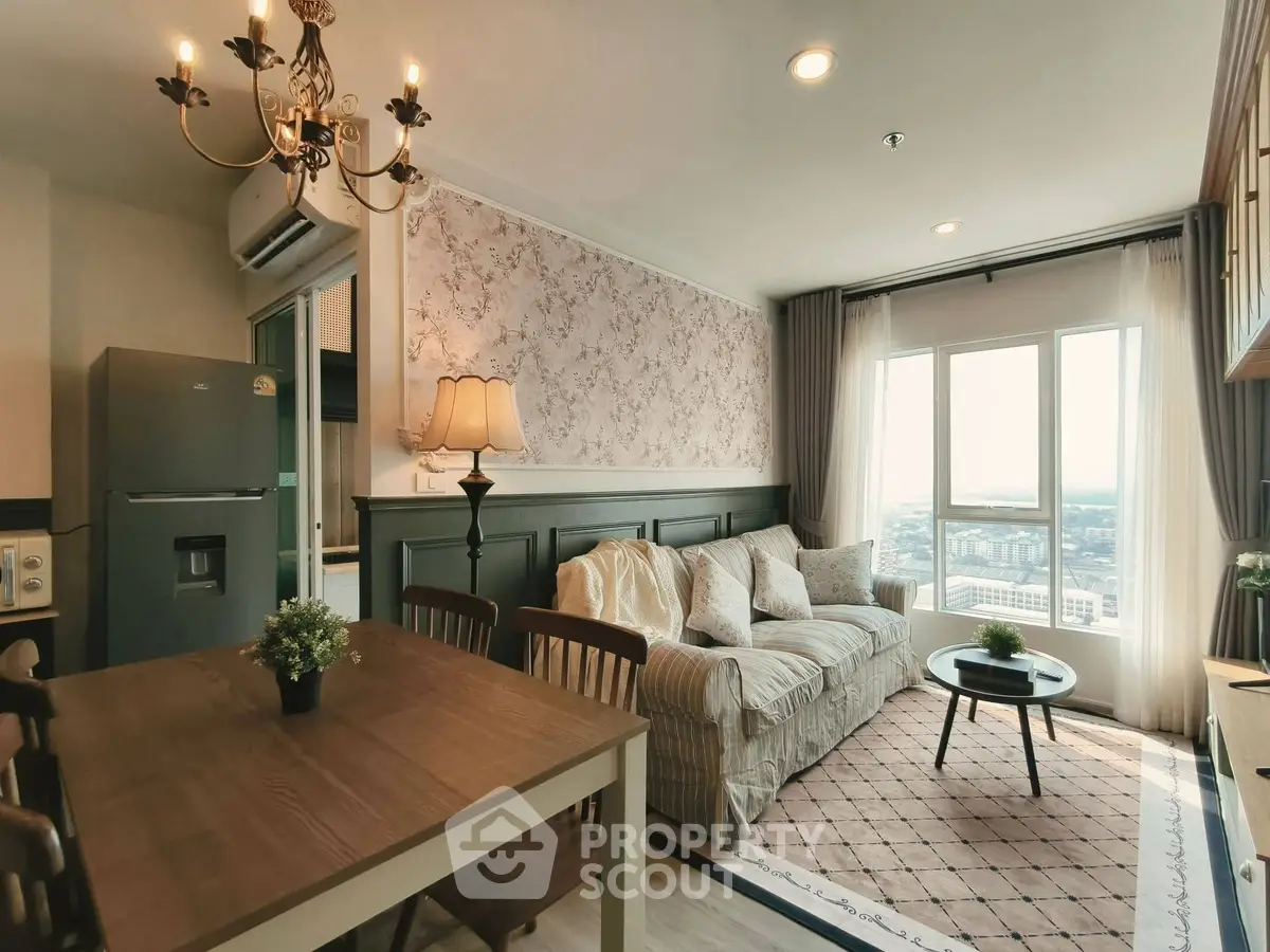 Charming living room with elegant decor and city view, featuring cozy seating and stylish dining area.