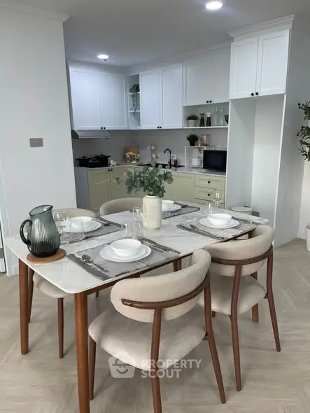 Modern kitchen with elegant dining set and stylish cabinetry