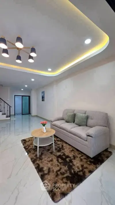Modern living room with stylish lighting and cozy sofa in a contemporary home.