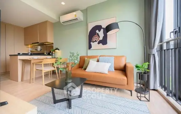 Modern living room with stylish decor and open kitchen layout