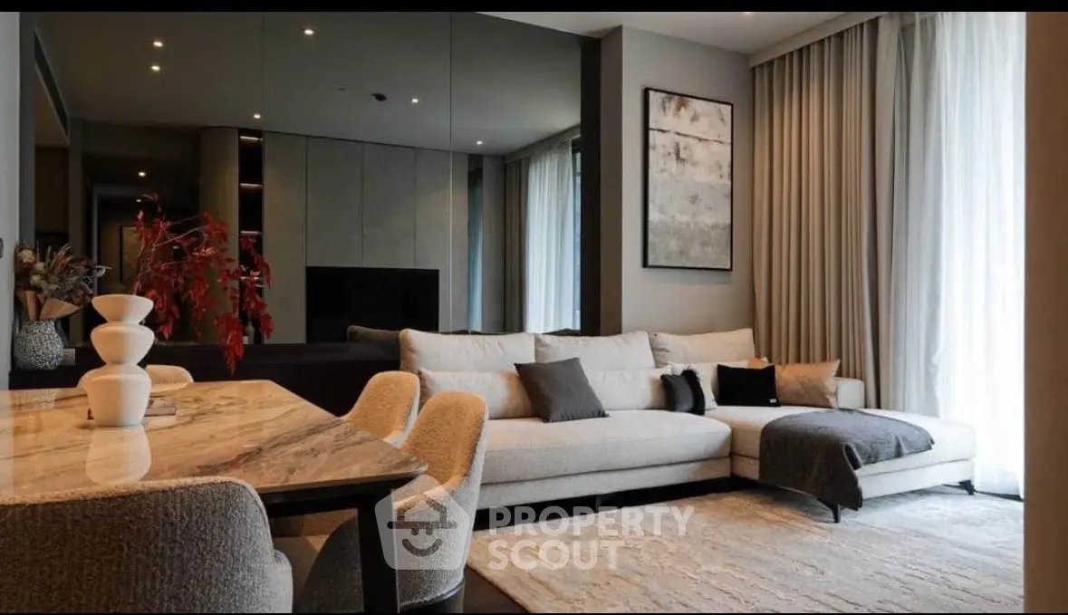 Luxurious modern living room with elegant decor and spacious seating area.