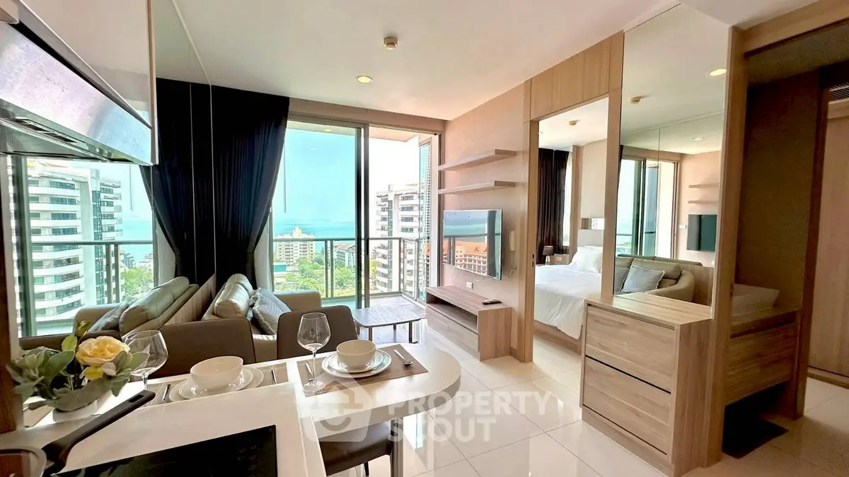 Luxurious modern condo with ocean view, open living space, and elegant decor.