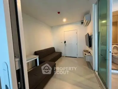 Modern living room with sleek furniture and air conditioning in a cozy apartment.
