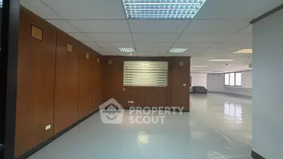 Spacious office interior with modern lighting and polished floors