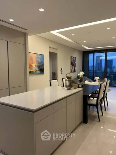 Luxurious modern kitchen with open layout and elegant dining area, featuring cityscape views.