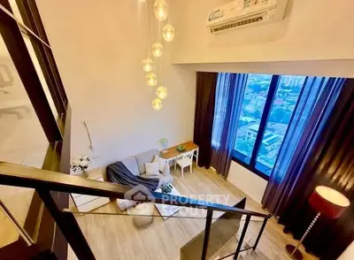 Stunning loft-style living room with high ceilings and panoramic city view, featuring modern decor and elegant lighting.