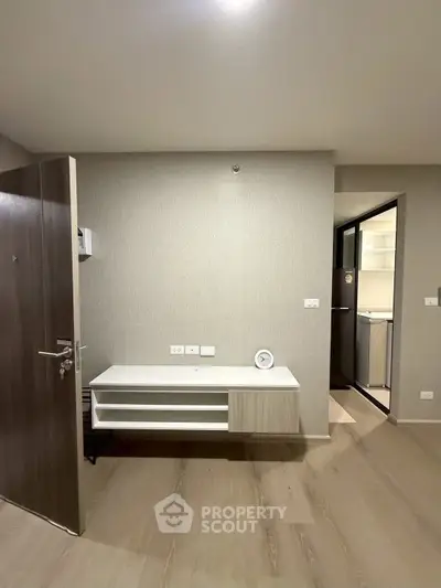 Modern apartment interior with sleek wooden flooring and minimalist design