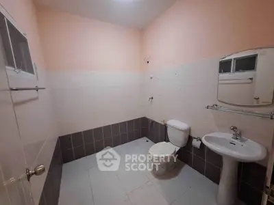 Spacious bathroom with modern fixtures and neutral tiles