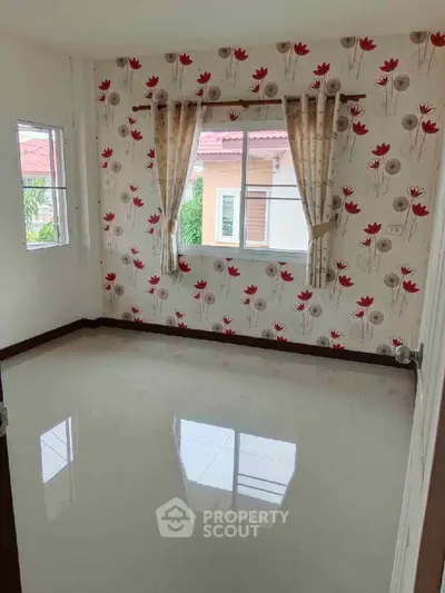 Bright empty room with floral wallpaper and glossy tiled floor, ideal for customization.