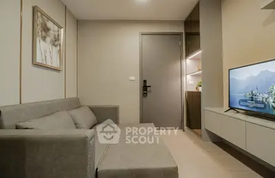 Modern living room with sleek sofa and wall-mounted TV, minimalist decor